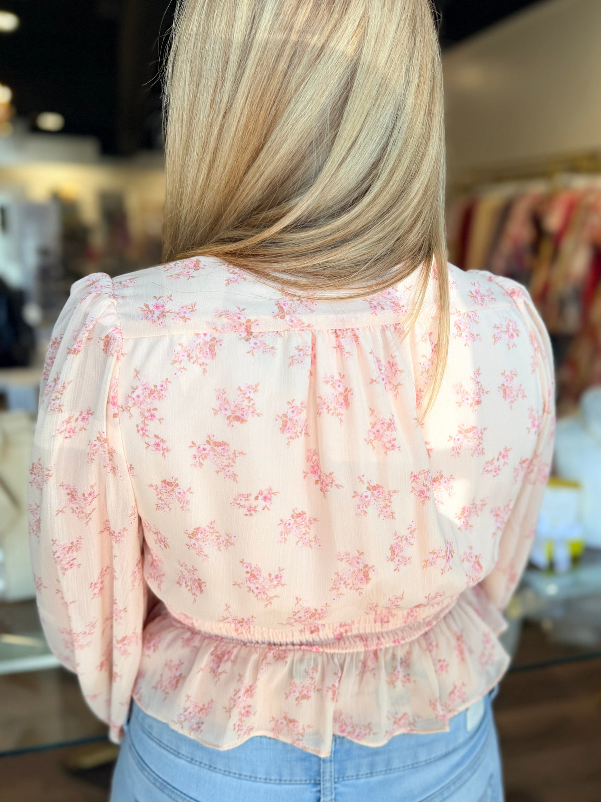 Back of floral blouse top in pink