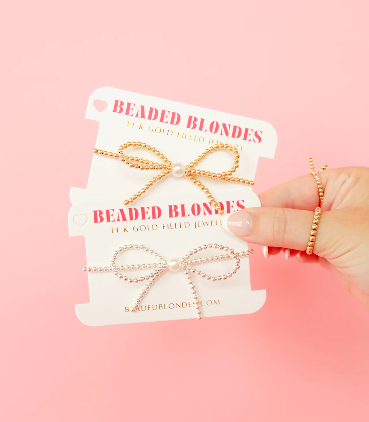 BOUTIQUE BEADED BLONDES GOLD BOW BRACELET ON CARD