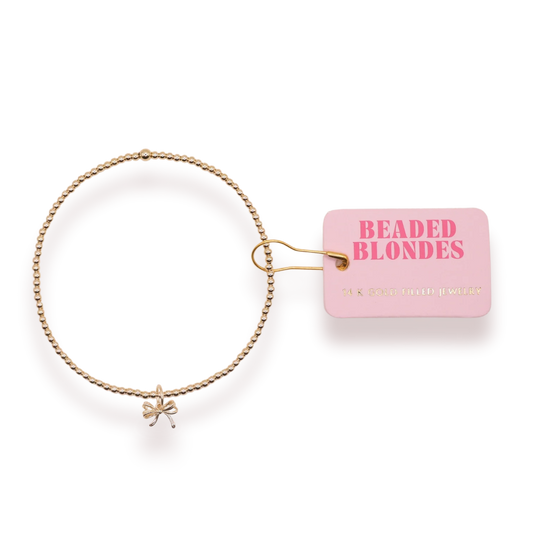 BOUTIQUE BEADED BLONDES GOLD BOW CHARM BRACELET