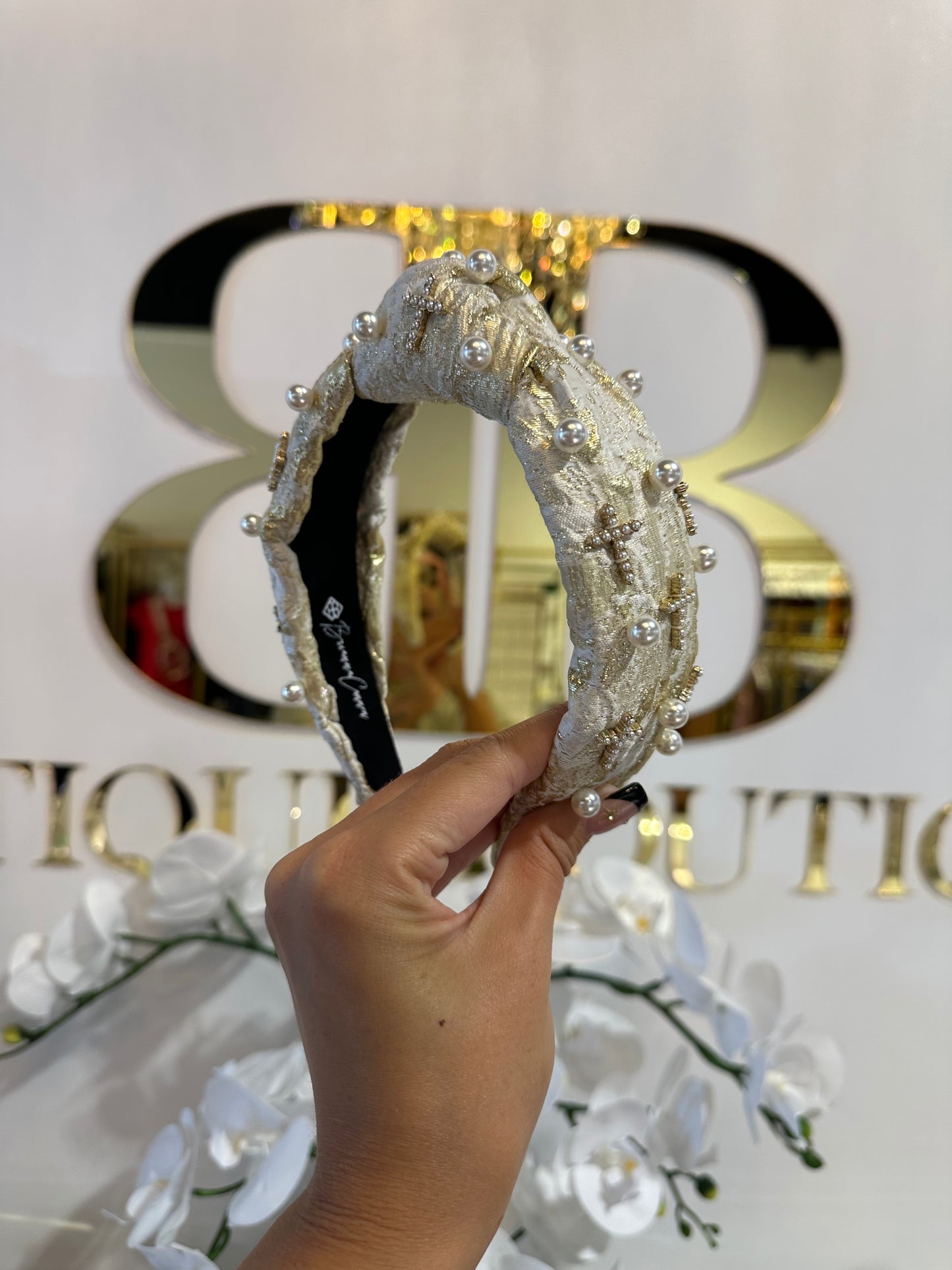 BOUTIQUE BRIANNA CANNON HEADBAND GOLD AND IVORY WITH PEARLS AND CROSSES IN HAND
