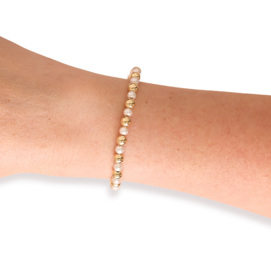 Beaded Blondes Anna Pearl Bracelet Gold shown on a wrist.