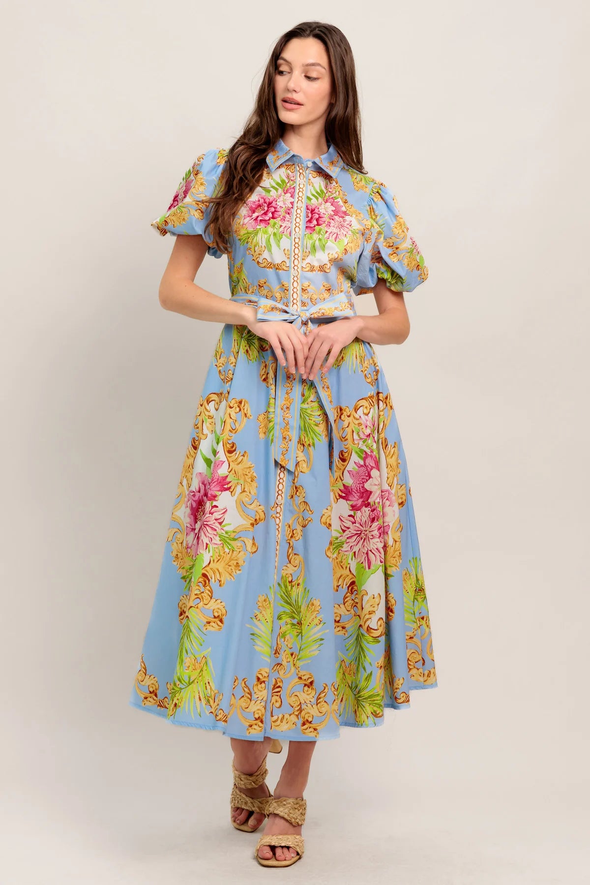Woman wearing a floral dress with a light background