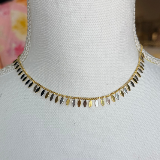 Necklace on a mannequin with a blurred background
