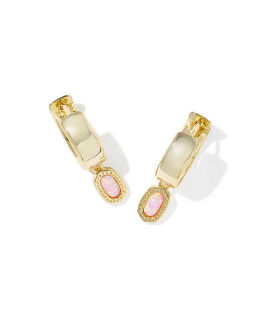 Gold hoop earrings with pink gemstones on a white background