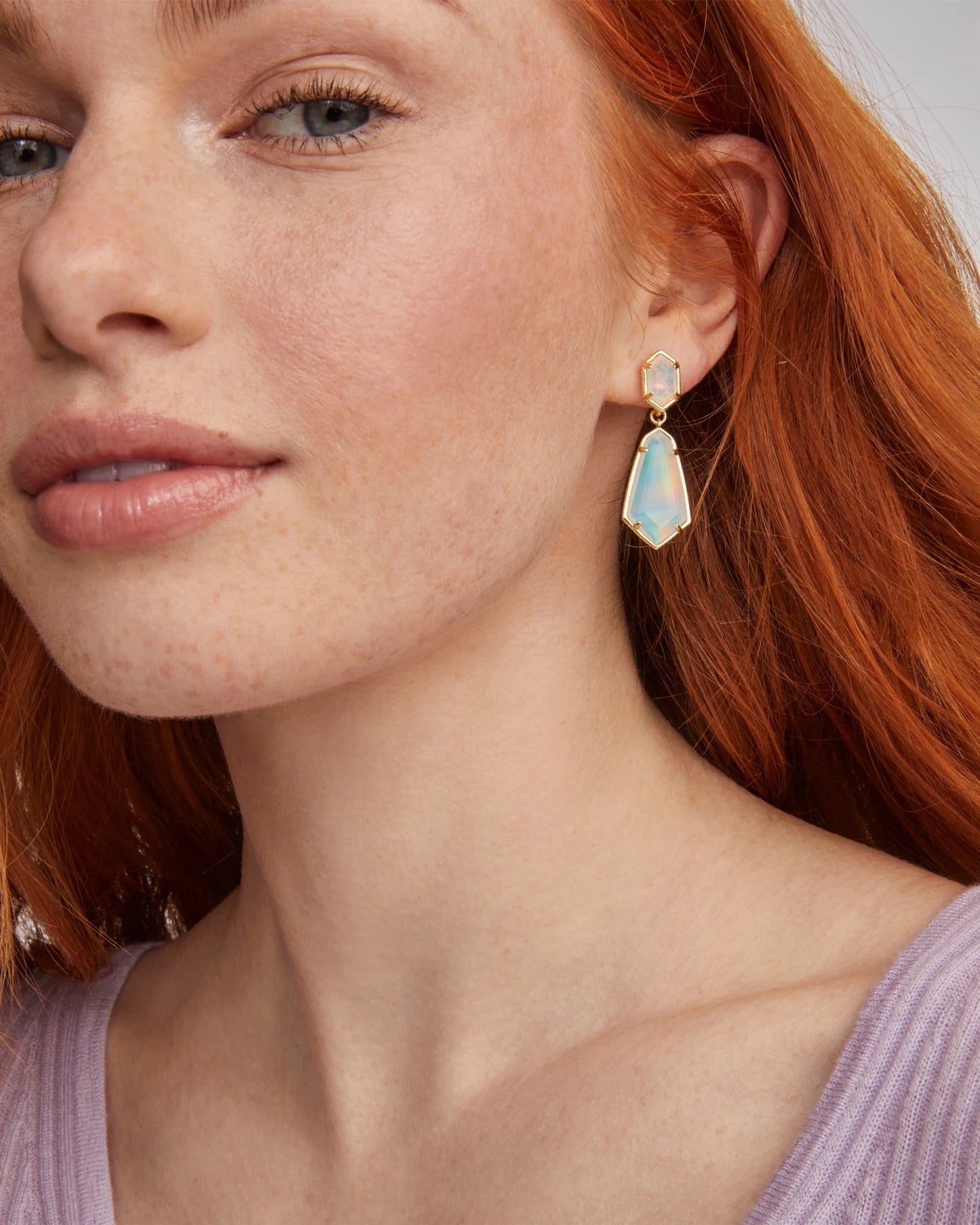 BOUTIQUE KENDRA SCOTT HALLIE GOLD CONVERTIBLE DROP EARRINGS WHITE OPAL IN EAR