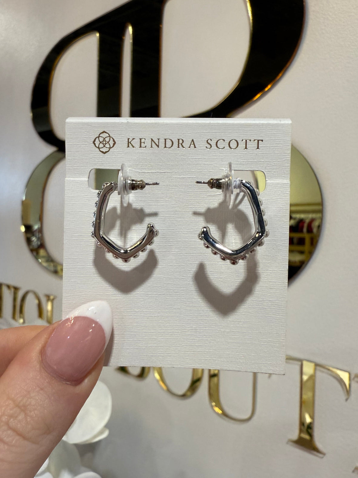 BOUTIQUE KENDRA SCOTT LONNIE SILVER BEADED HUGGIE EARRINGS IN HAND