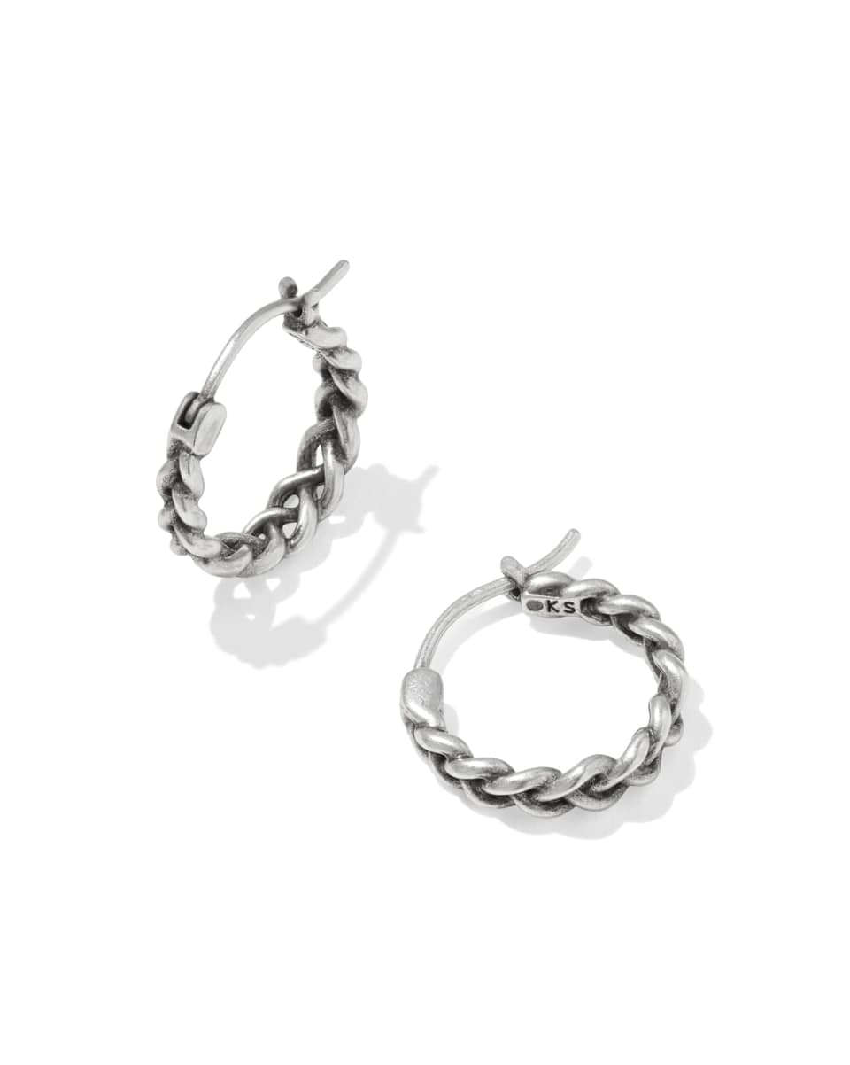 Pair of silver hoop earrings on a white background