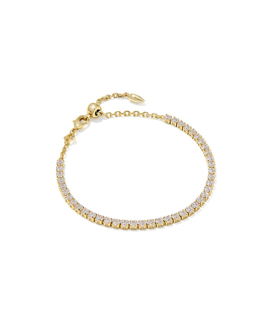 Gold bracelet with clear stones on a white background