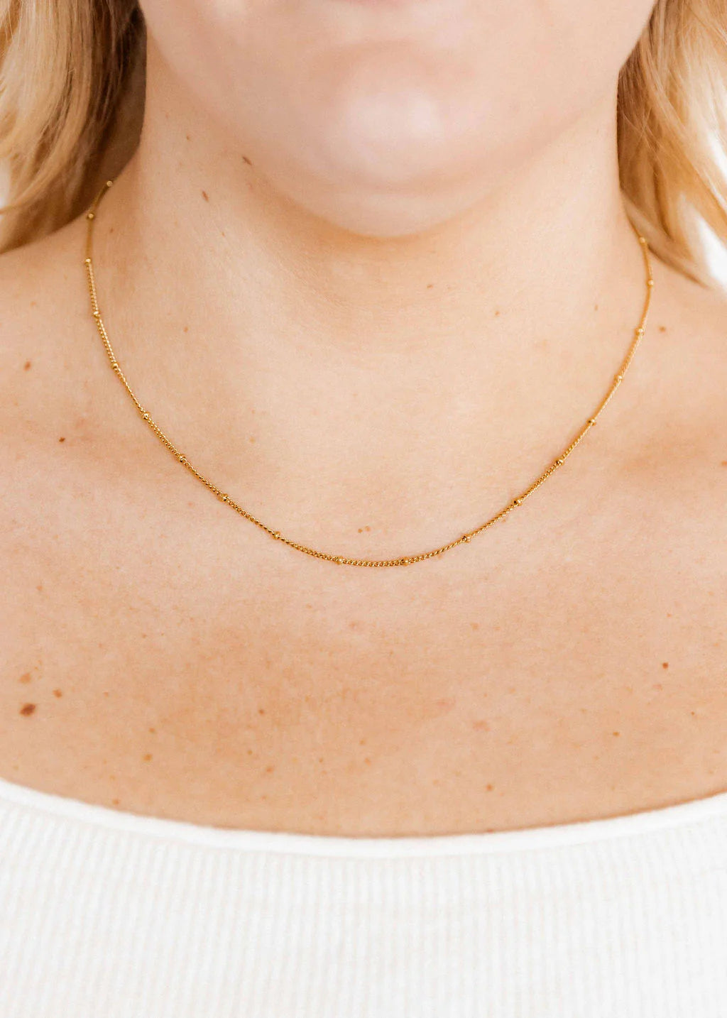 BOUTIQUE LINNY CO GOLD CHAIN BEAD NECKLACE MILES ON NECK