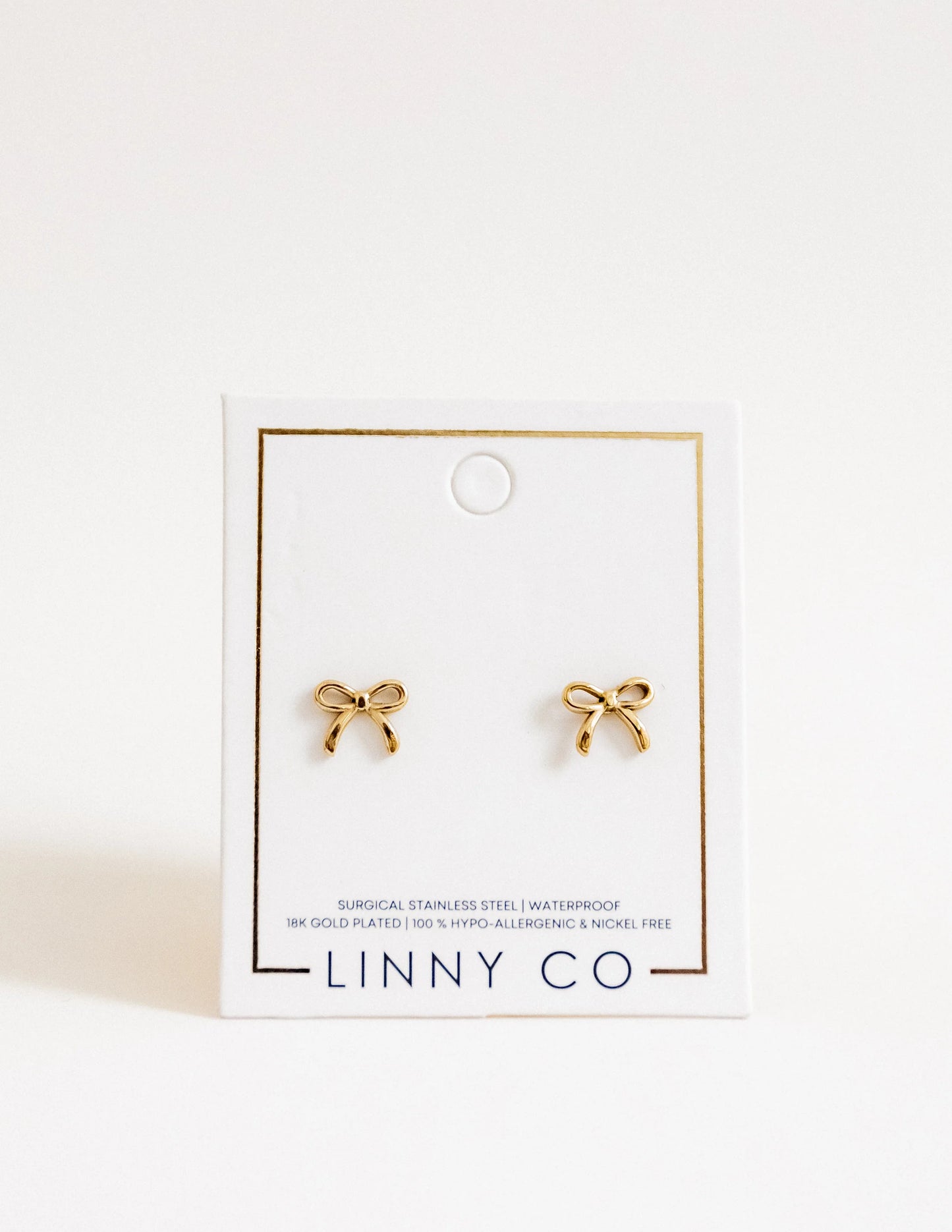 BOUTIQUE LINNY CO SCREWBACK STUD EARRINGS SADIE BOW GOLD ON CARD