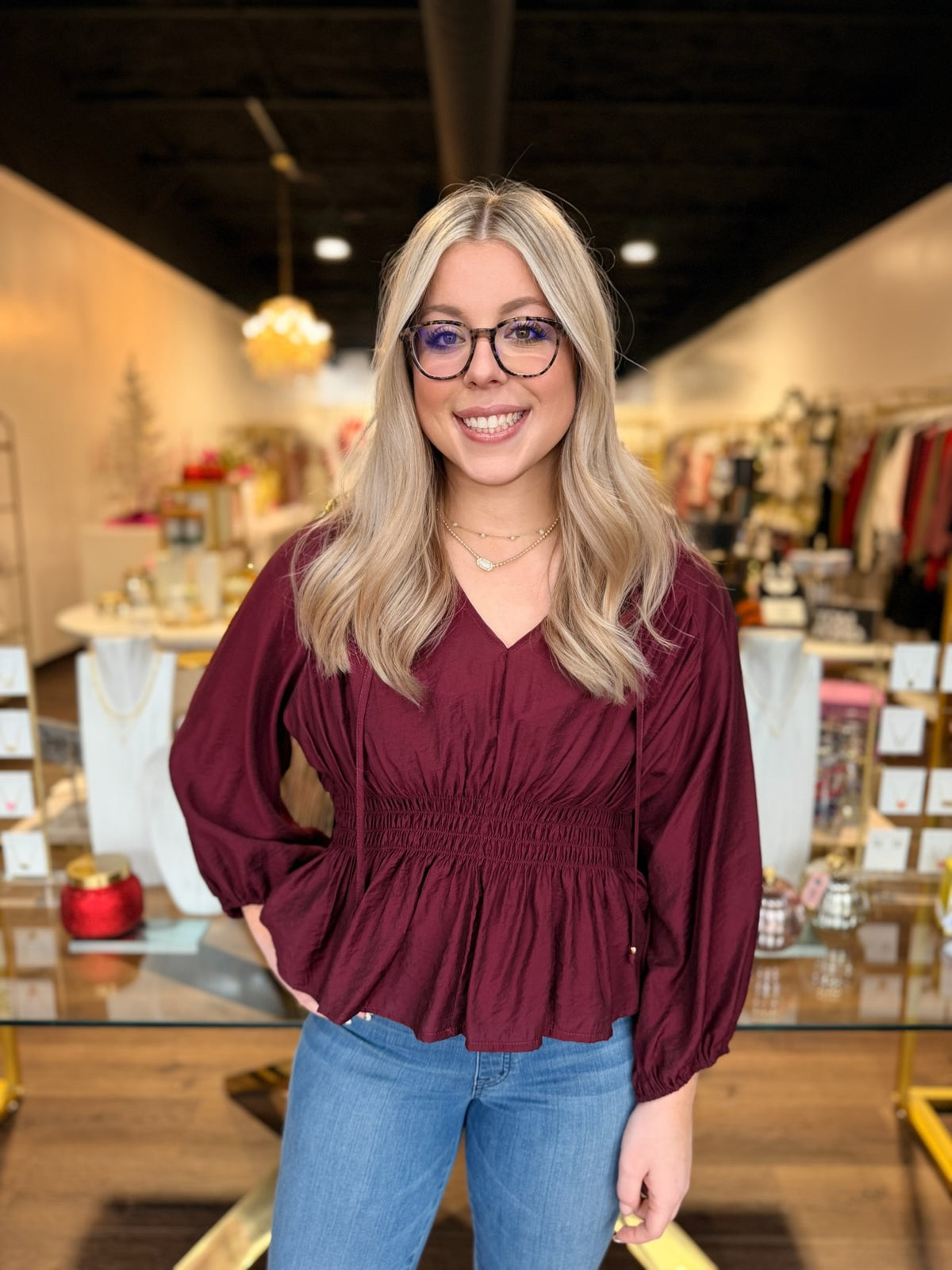 BOUTIQUE PLUMBERRY BABYDOLL BLOUSE ON MODEL