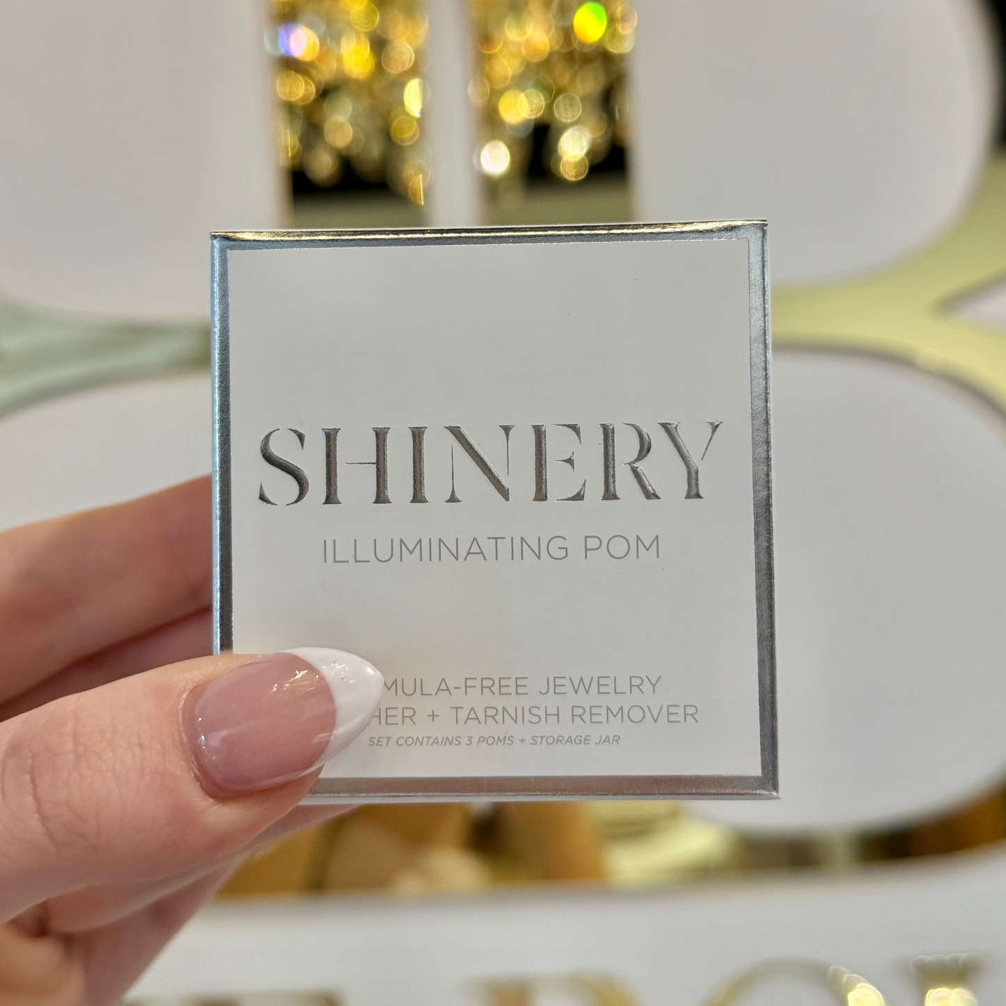 BOUTIQUE SHINERY JEWELRY ILLUMINATING POM TARNISH ERASER IN HAND