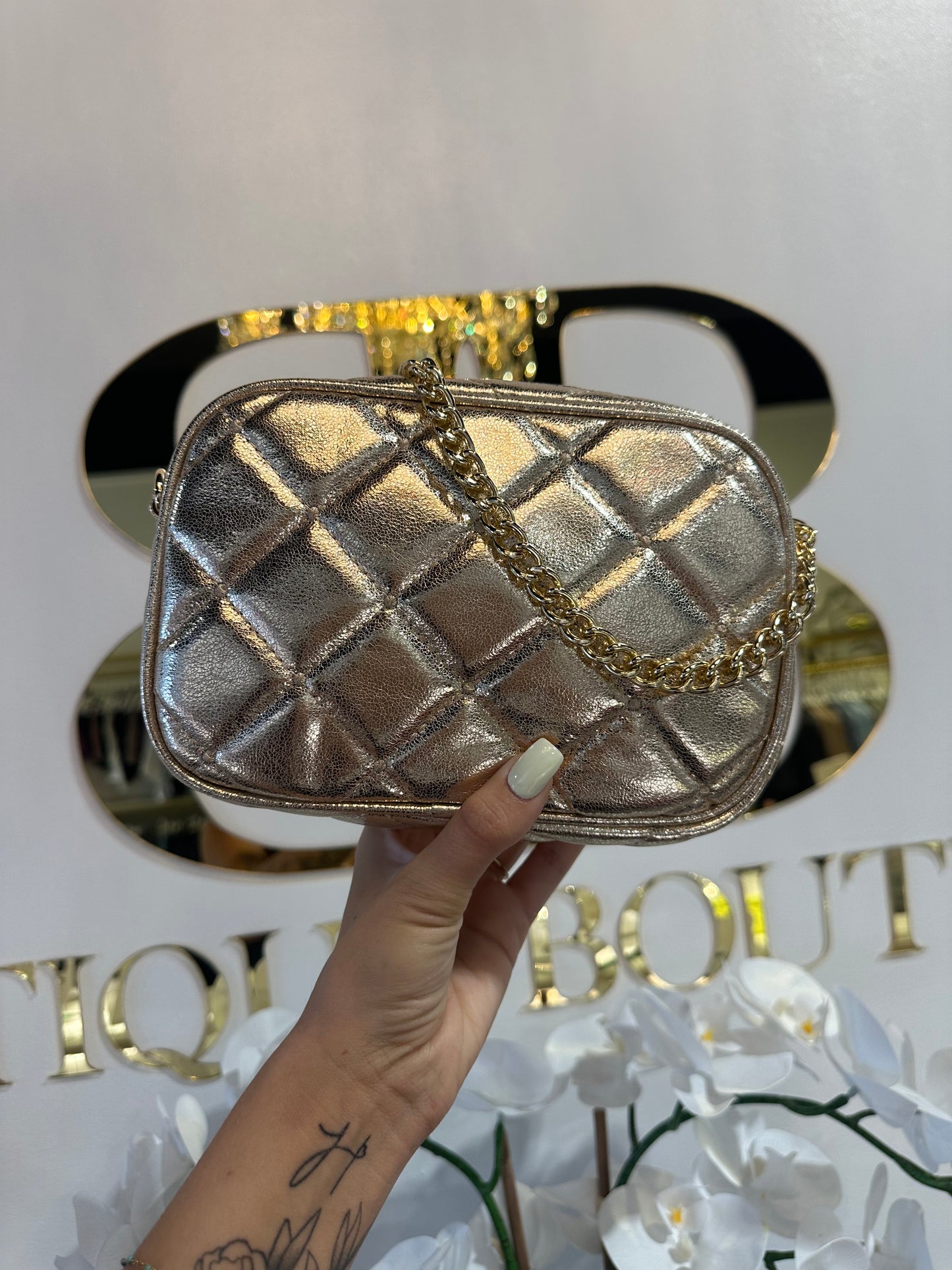 BOUTIQUE SHIRALEAH MADEMOISELLE CAMERA BAG GOLD FRONT IN HAND