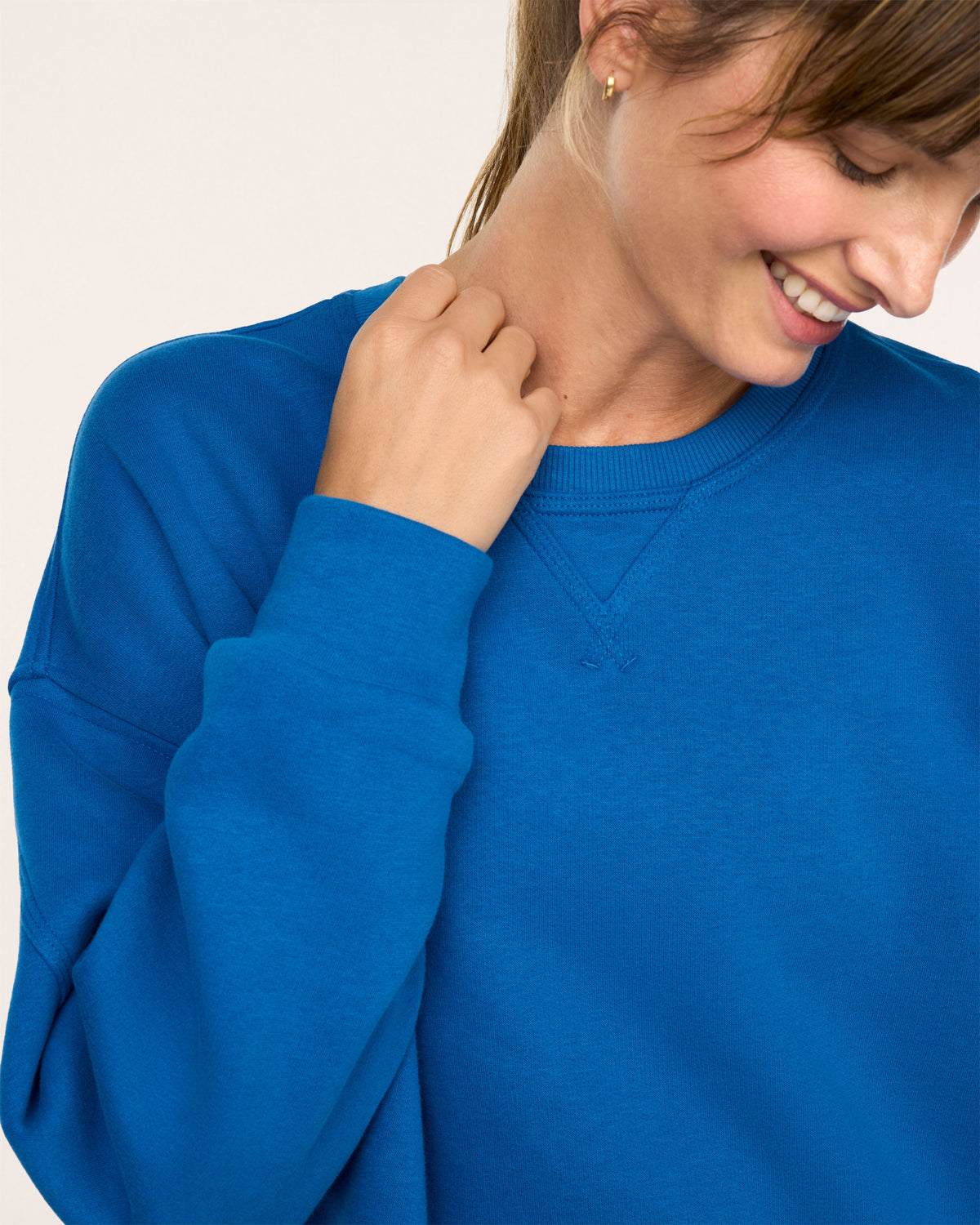 Close up neck line view of SPANX® BoostUp Cotton Fleece Crewneck Tunic - Cadet Blue