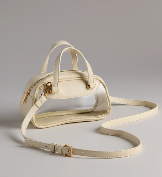 Beige handbag with a strap on a gray background