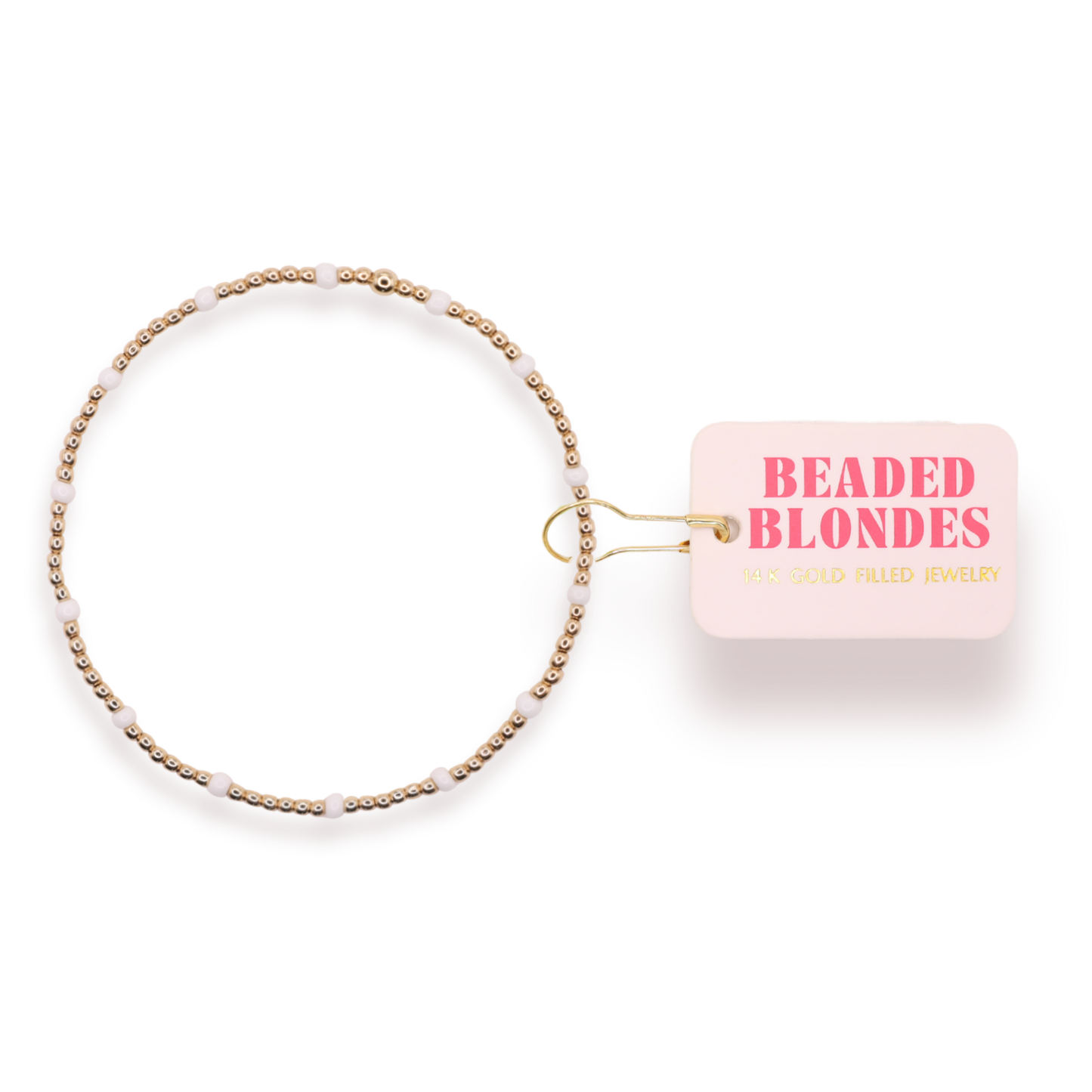 Beaded hair accessory with 'Beaded Blondes' packaging on a white background