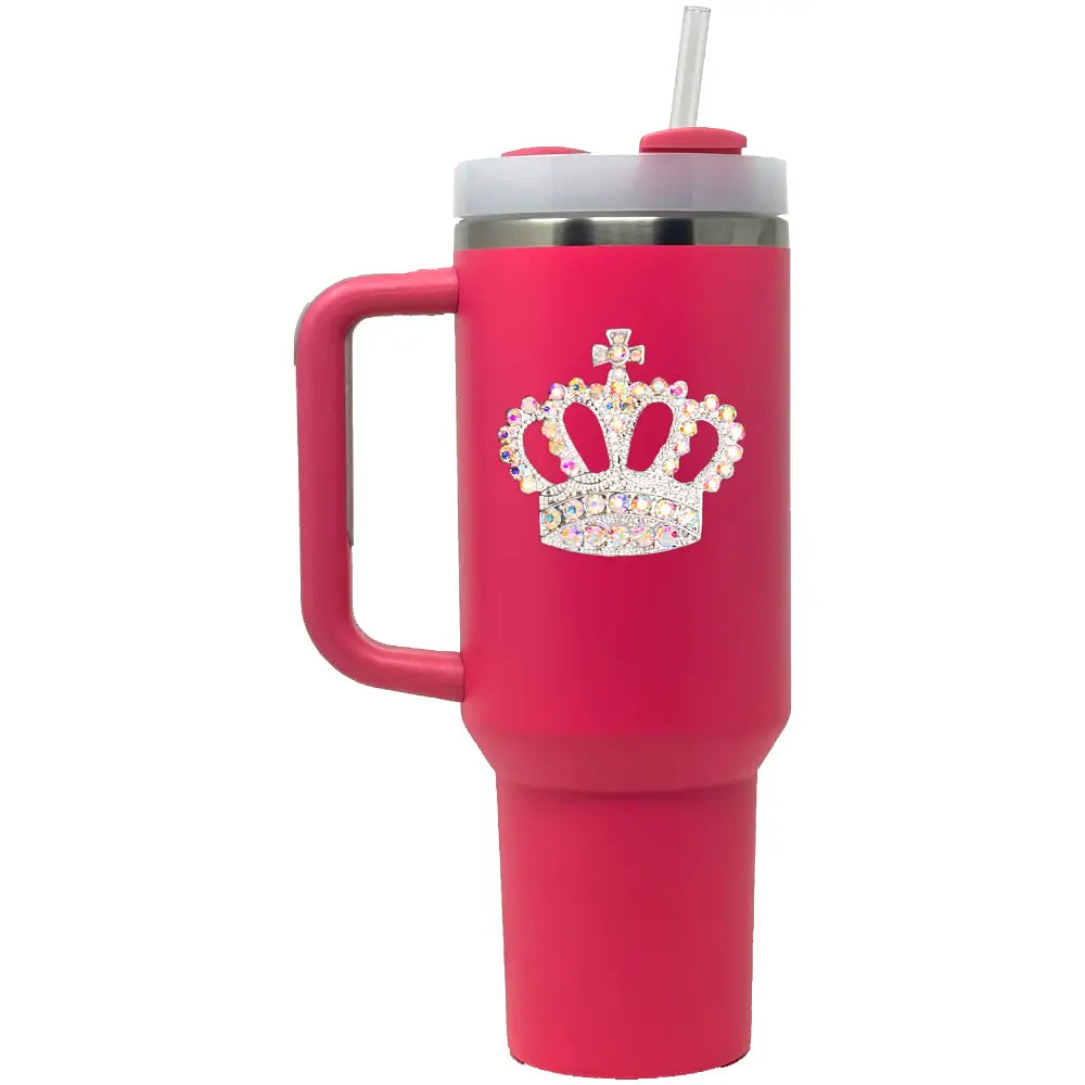 Pink tumbler with a crown design and handle on a white background
