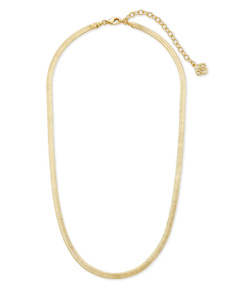 Gold snake chain on white background