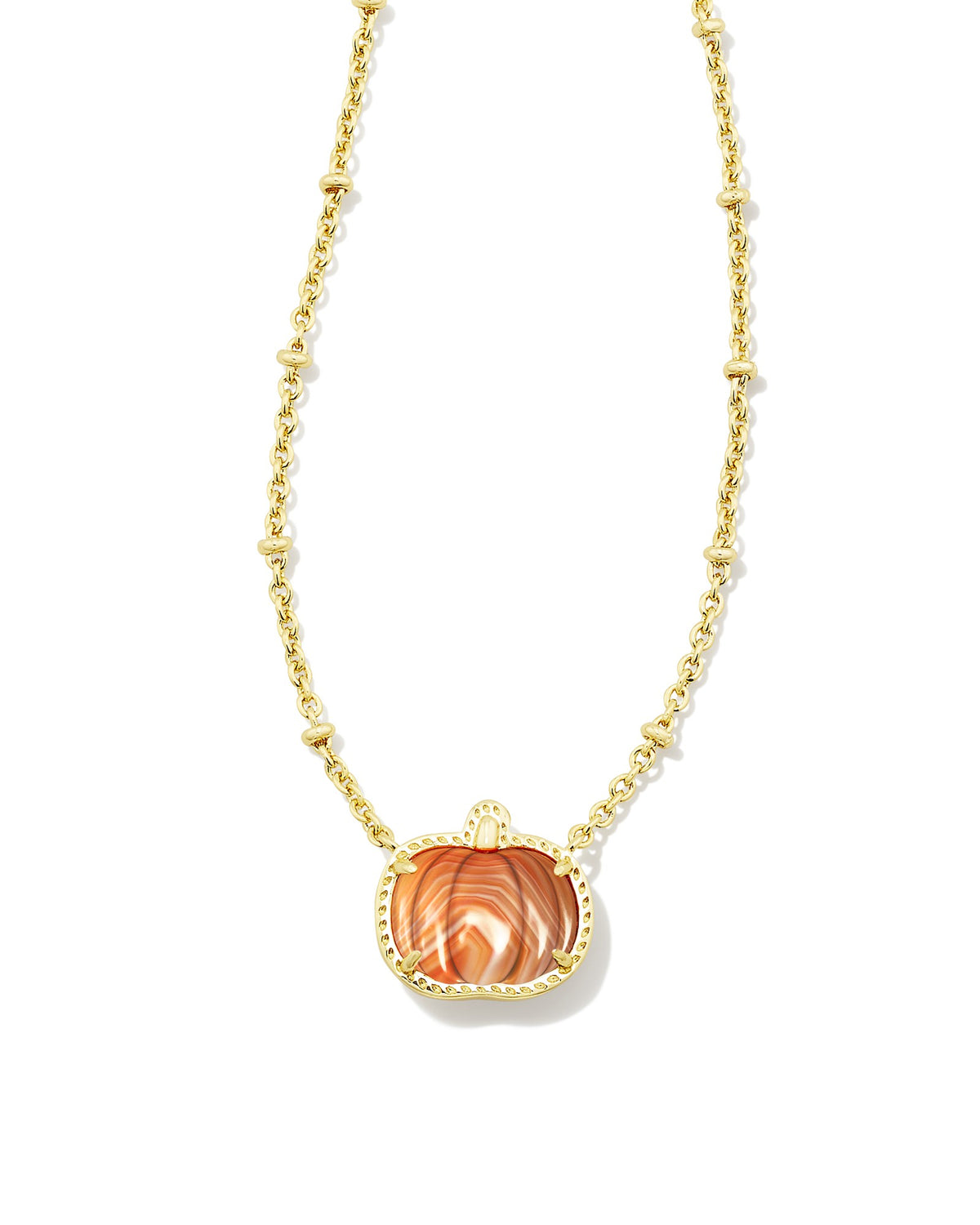Gold necklace with orange pumpkin pendant on white background