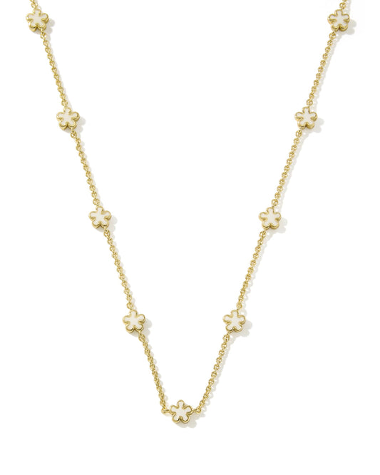 gold strand necklace with white flowers