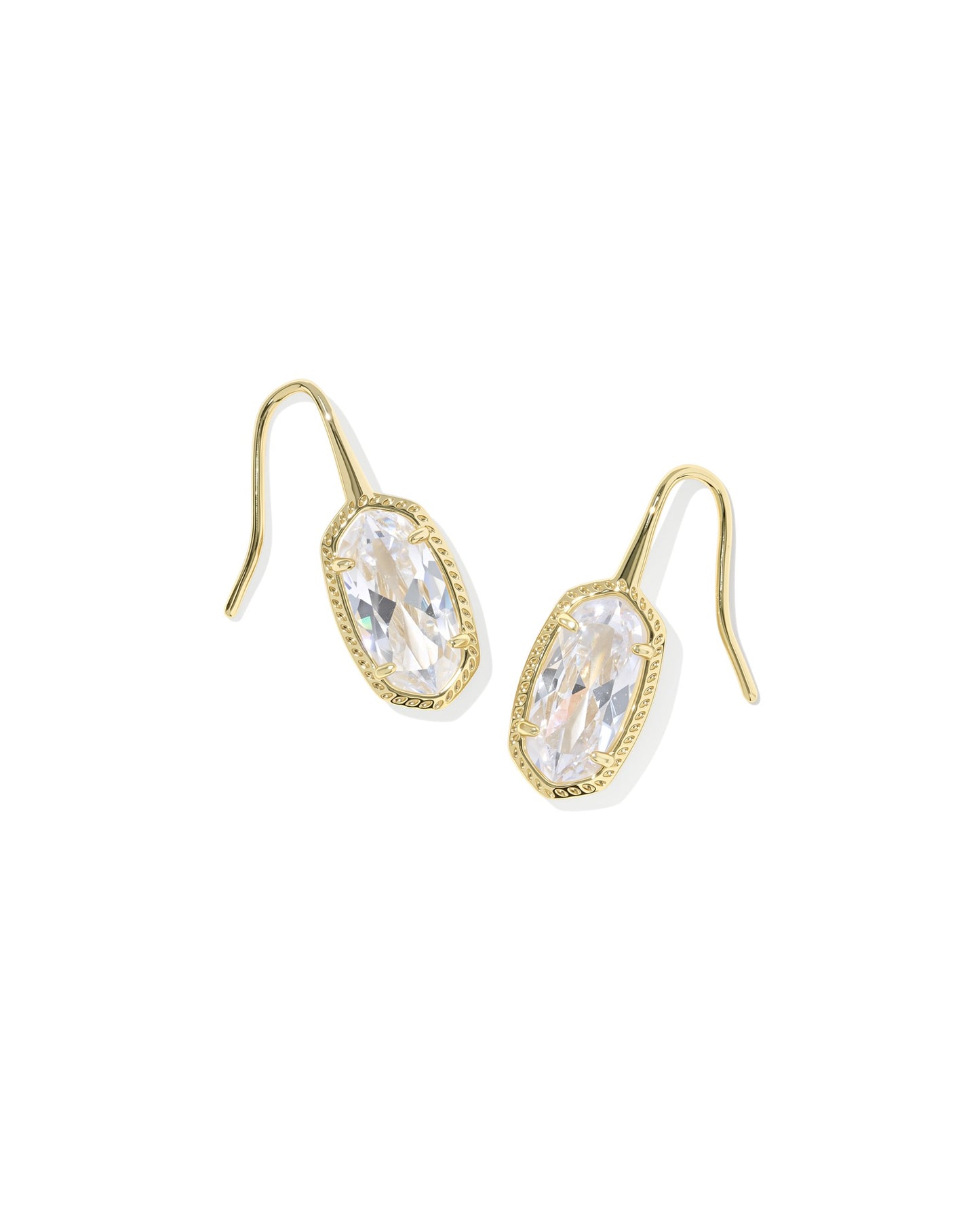 Kendra scott gold drop earrings with clear pendant on white background