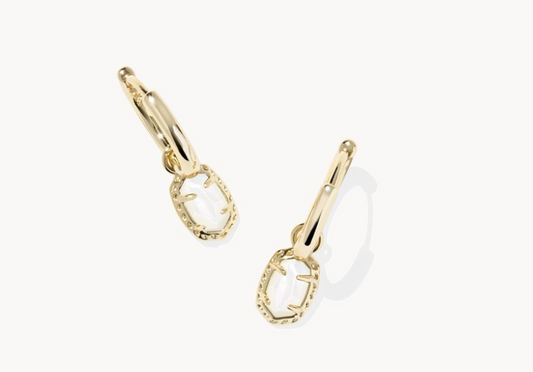 Kendra Scott Gold hoop earrings with a small circular design on a white background