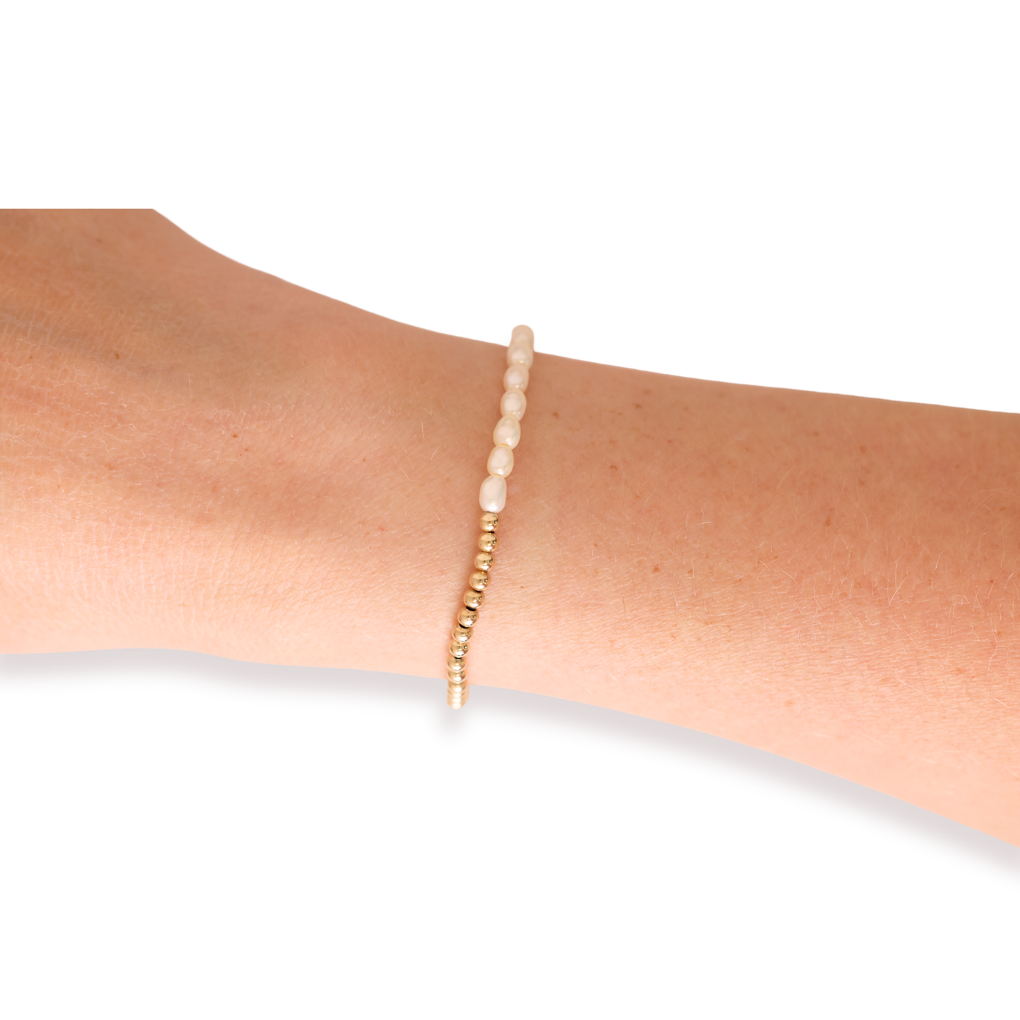 Bracelet on a person's wrist against a white background