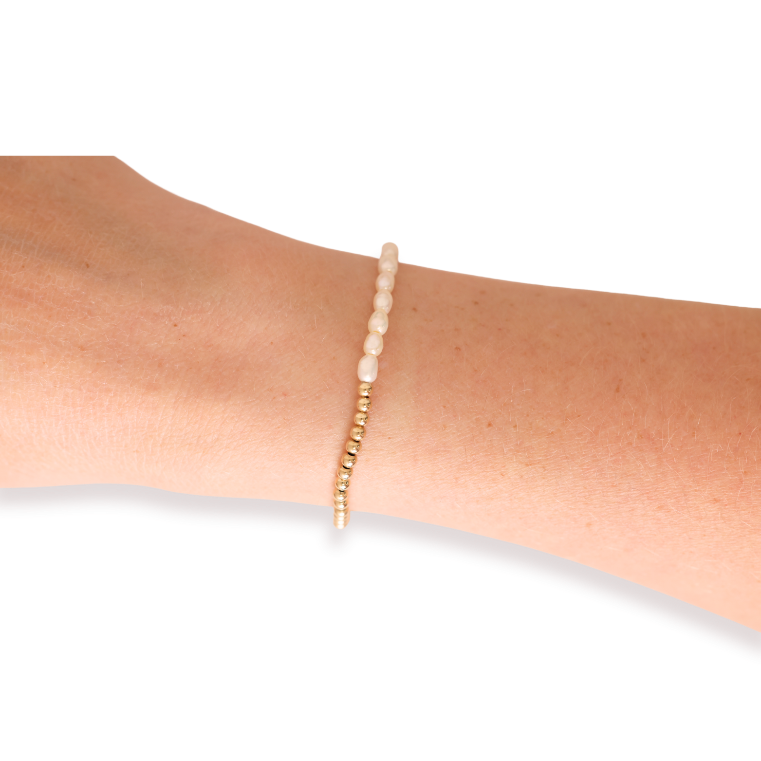Bracelet on a person's wrist against a white background