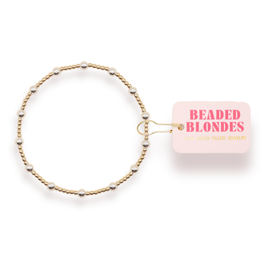Beaded bracelet with 'Beaded Blondes' packaging on a white background