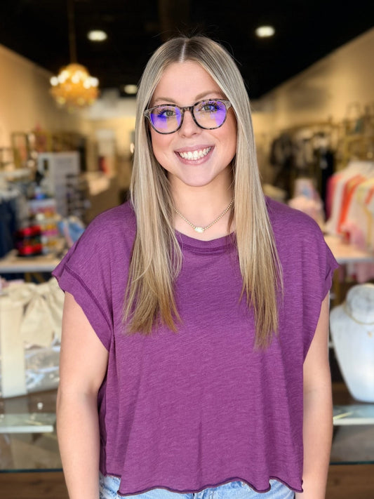 model wearing purple short sleeve top