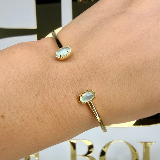 Kendra Scott light blue stone cuff in front of BB 