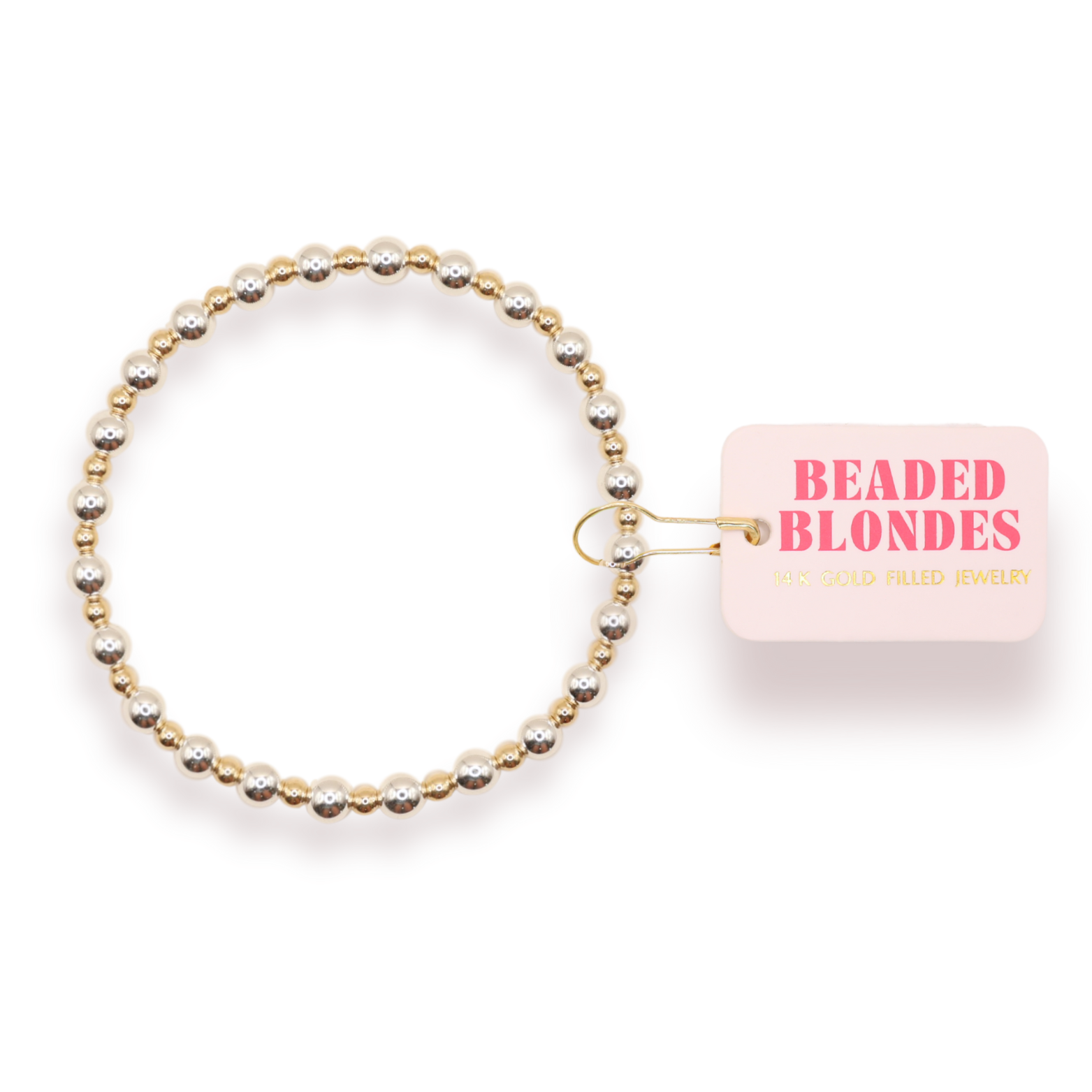 A beaded stretch bracelet with alternating gold and silver-toned beads, shown with a pink tag that reads 'BEADED BLONDES' on a white background.