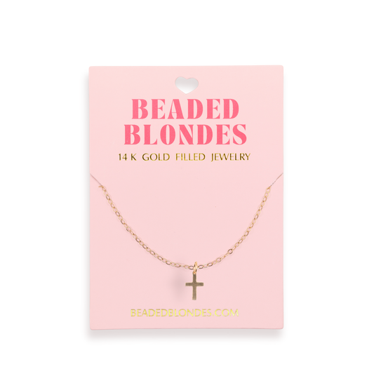 Gold necklace on a pink card with 'Beaded Blondes' branding