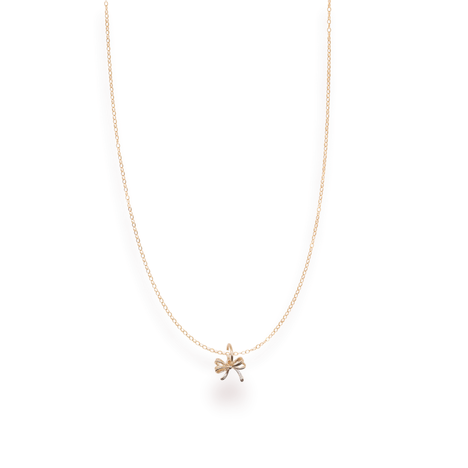 Gold necklace with a small pendant on a white background