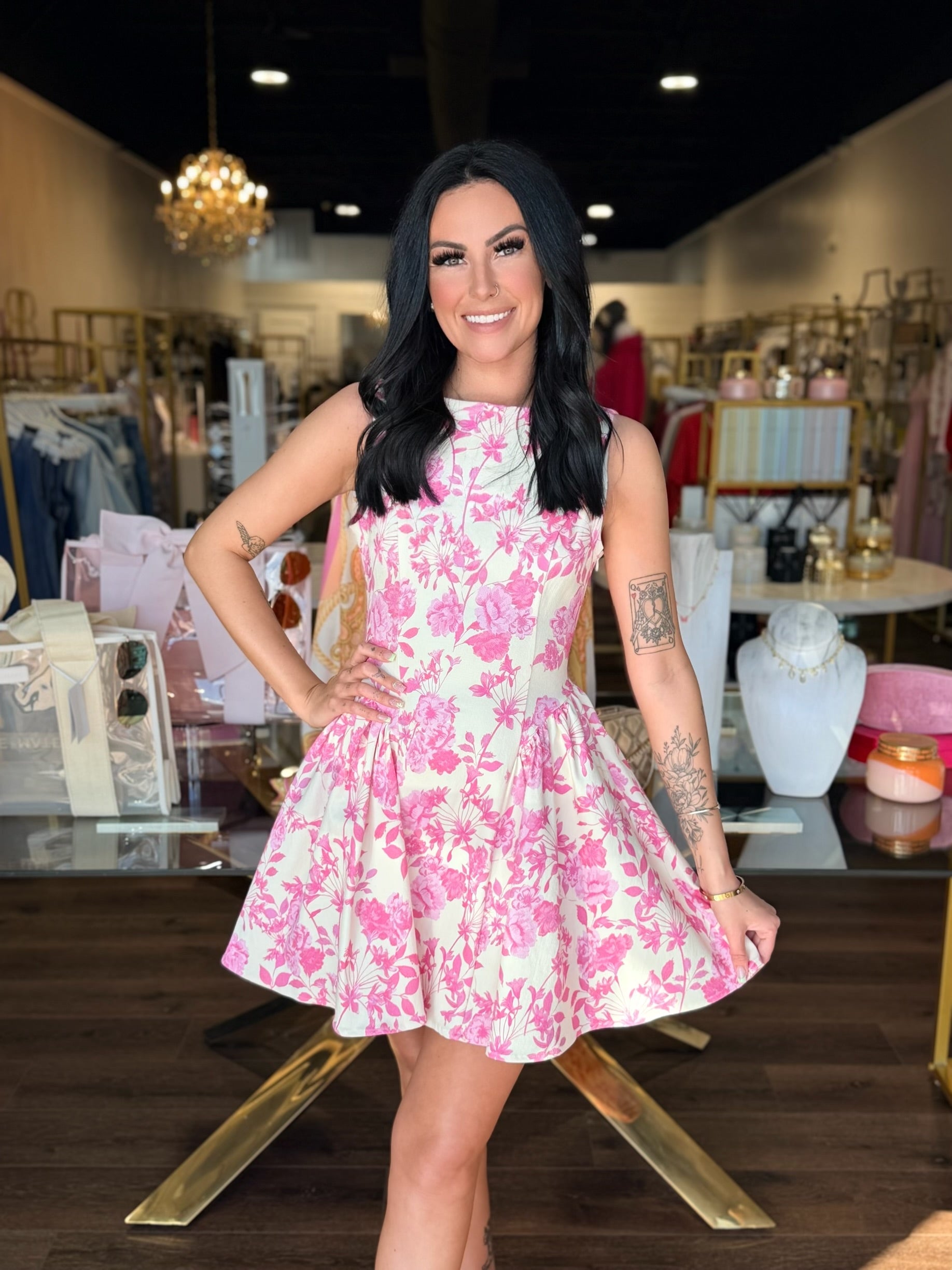 Model in mini dress with pink floral 