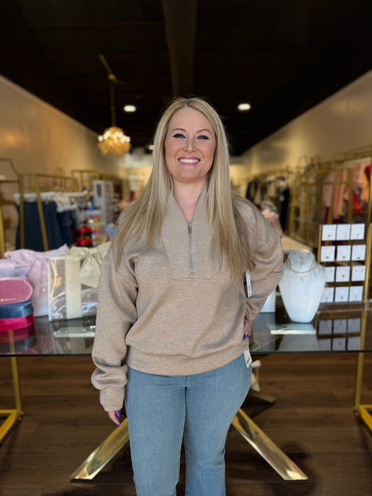 model wearing brown heather long sleeve top with jeans 