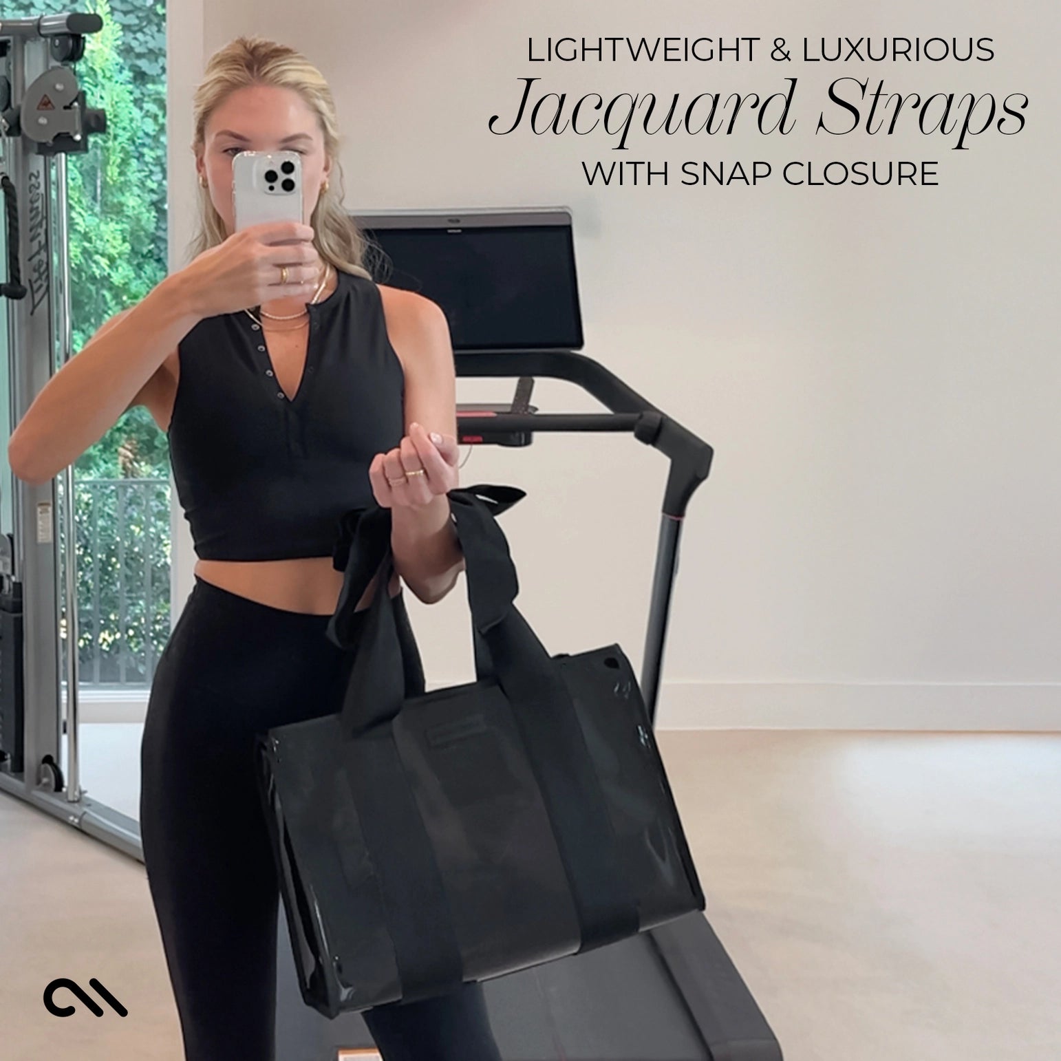 Woman holding a black tote bag in a gym setting with text about Jacquard straps and snap closure.