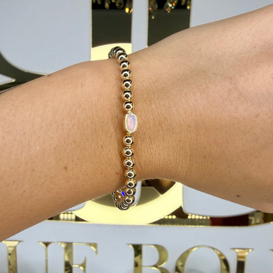 Bracelet on a wrist with decorative background