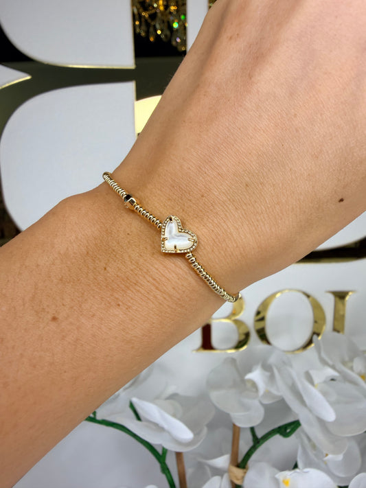 Kendra Scott gold beaded stretch bracelet with white heart