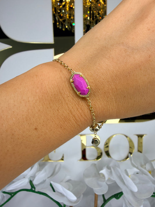 Kendra Scott gold bracelet with pink stone