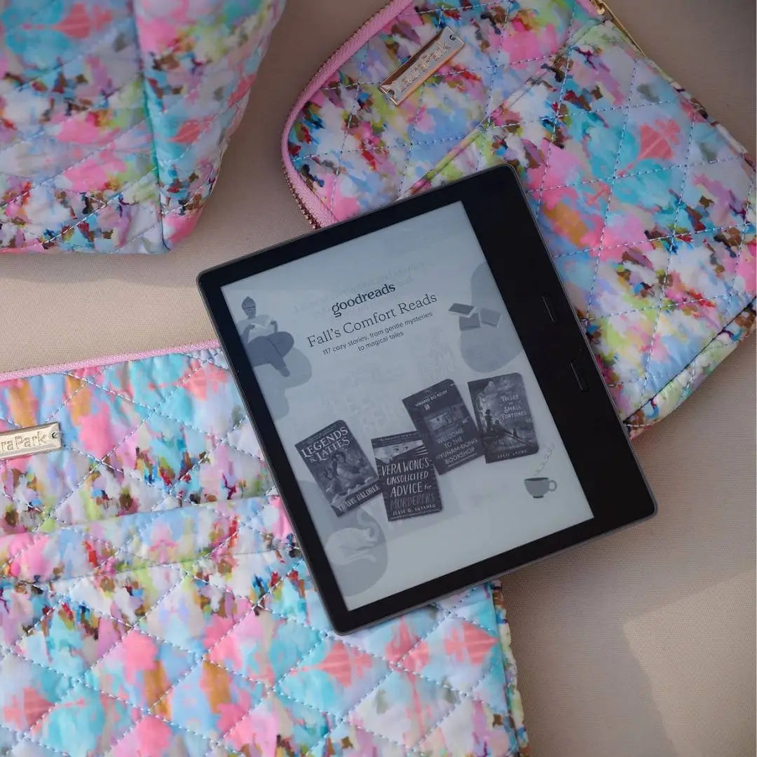 E-reader on a colorful quilt with cases