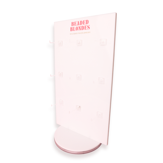 Pink cylindrical container with 'Beaded Blondes' branding on a white background
