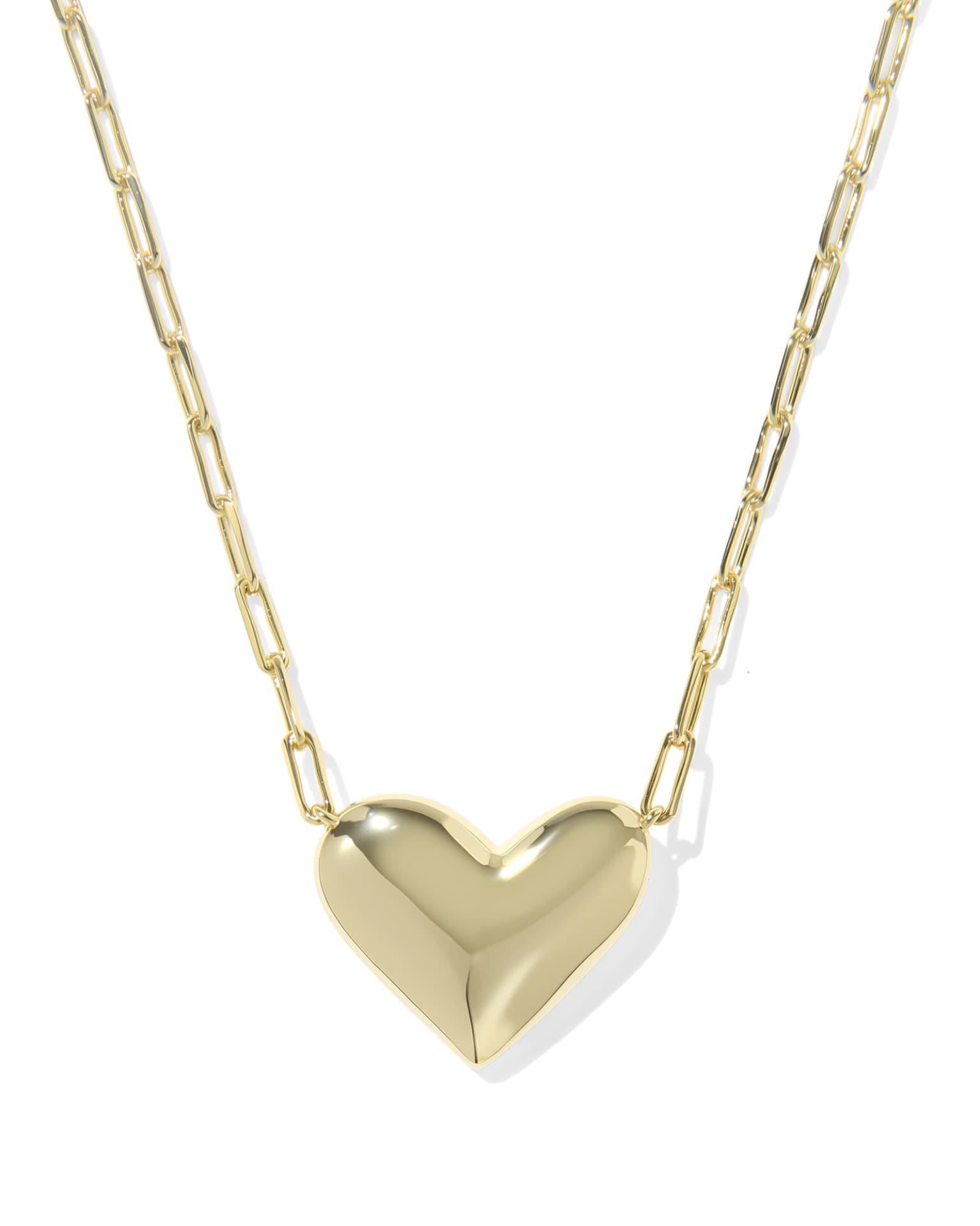 Gold heart-shaped pendant necklace on a white background