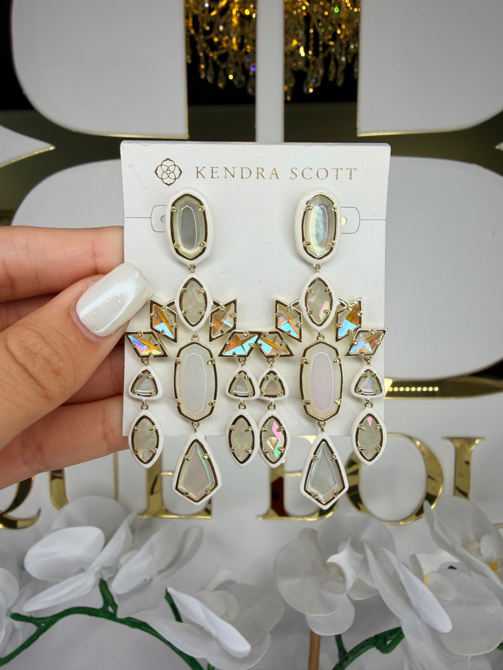 Gold Kendra Scott earrings with white and pearl