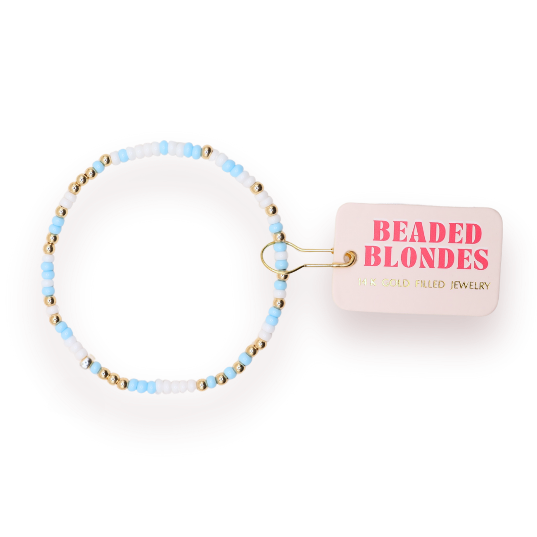 Beaded blondes bracelet with 'Beaded Blondes' packaging on a white background