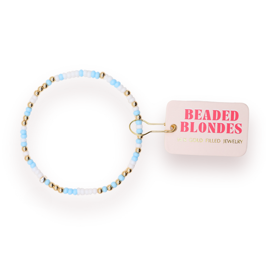 Beaded blondes bracelet with 'Beaded Blondes' packaging on a white background