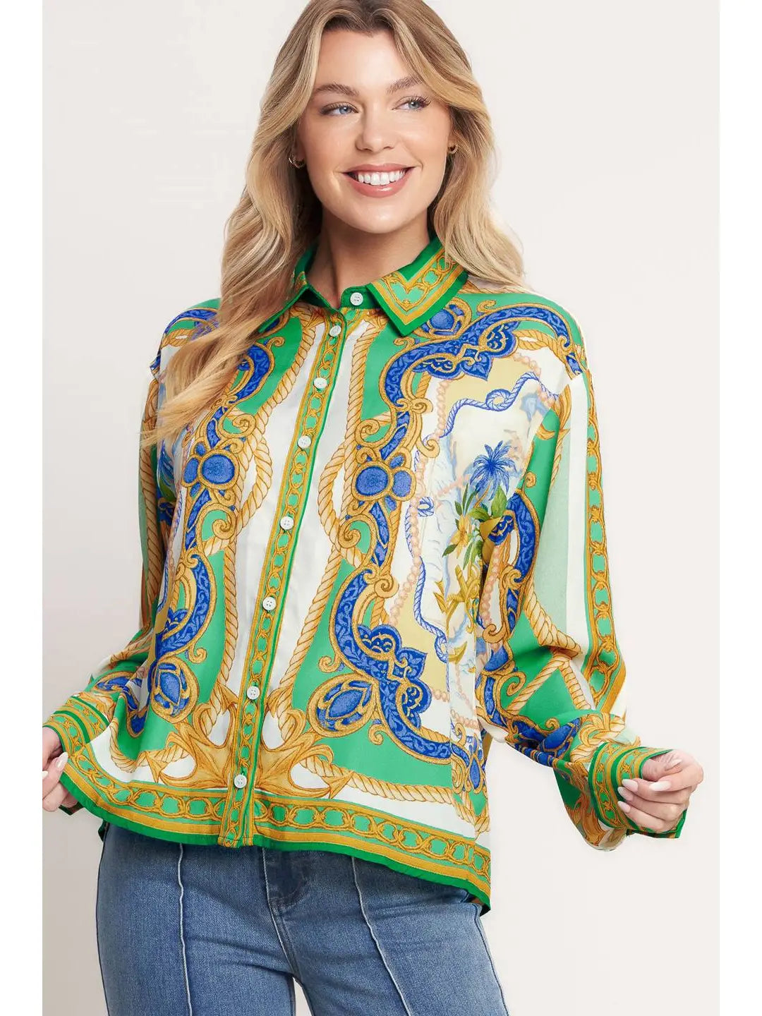 Woman wearing a colorful patterned shirt with a plain background