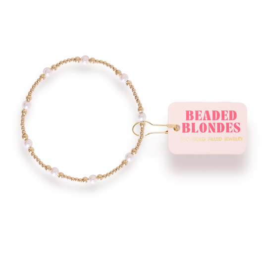Beaded blondes bracelet with a pink label on a white background