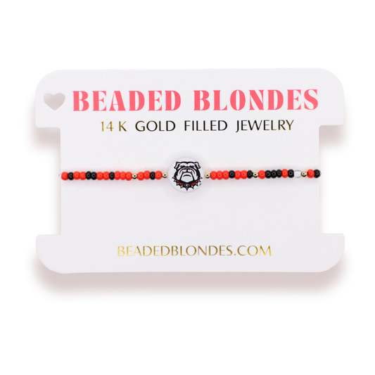 Beaded blondes 14k gold filled jewelry on a white card with brand name.