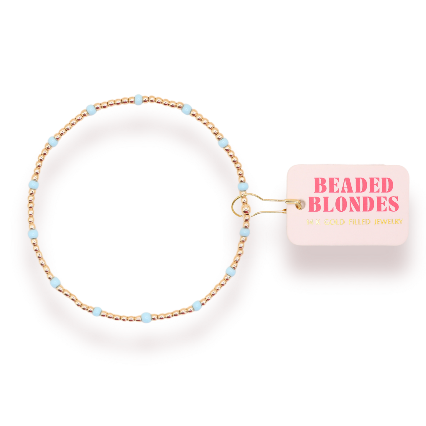 Beaded hair tie with 'Beaded Blondes' packaging on a white background